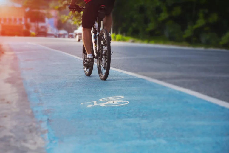 Close-up of a cyclist riding in a bike lane