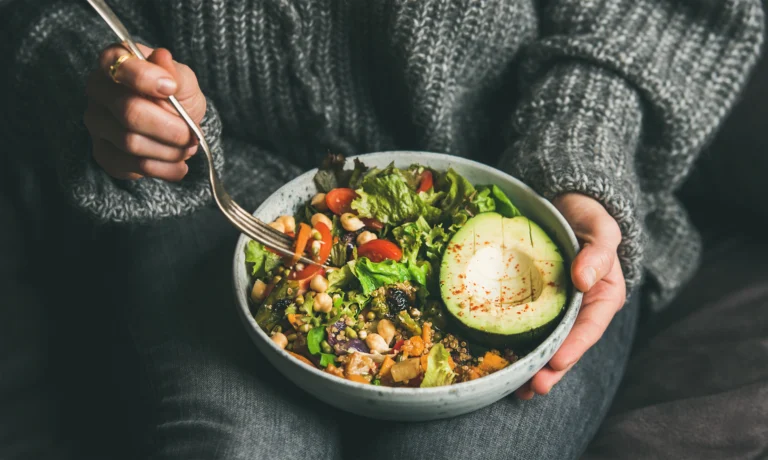Bowl of healthy food including vegetables and grains